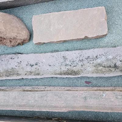 Sandstone edging rocks and a wood landscape stump