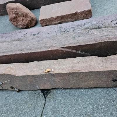 Sandstone edging rocks and a wood landscape stump