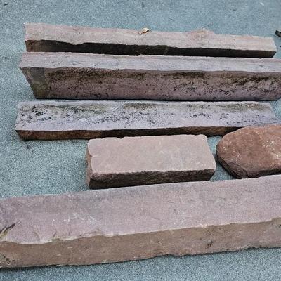 Sandstone edging rocks and a wood landscape stump