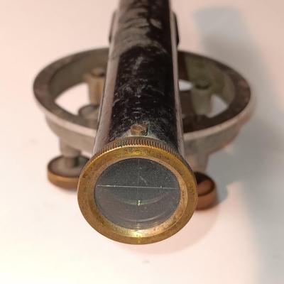 VINTAGE SURVEYORS TRANSIT LEVEL AND AN ANTIQUE TAPE MEASURE
