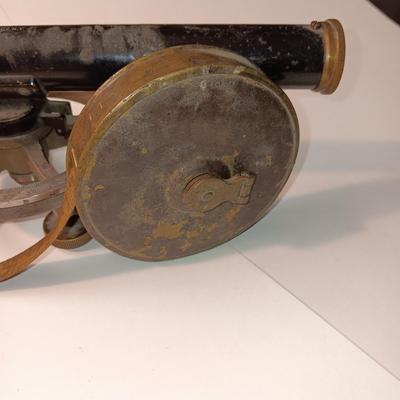 VINTAGE SURVEYORS TRANSIT LEVEL AND AN ANTIQUE TAPE MEASURE