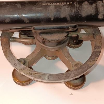 VINTAGE SURVEYORS TRANSIT LEVEL AND AN ANTIQUE TAPE MEASURE