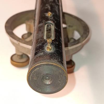 VINTAGE SURVEYORS TRANSIT LEVEL AND AN ANTIQUE TAPE MEASURE