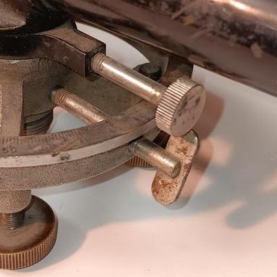 VINTAGE SURVEYORS TRANSIT LEVEL AND AN ANTIQUE TAPE MEASURE