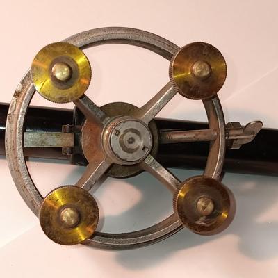 VINTAGE SURVEYORS TRANSIT LEVEL AND AN ANTIQUE TAPE MEASURE