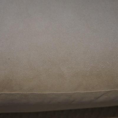 Contemporary style quality three cushion ultra suede style fabric sofa of a light olive-green color.