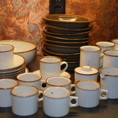 Sale Photo Thumbnail #92: for the after dinner coffee and dessert. 
Dansk  Niels Refsgaard stoneware 
7 cups  
6 saucers 
8 mugs 
4 8" serving plates
1 serving bowl
cream and sugar 
In addition are 9 Rowe pottery bowls