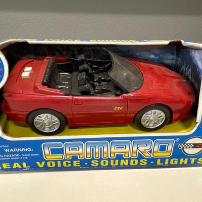 Micro machines a Camaro that makes sounds a Duncan yo-yo and a Shrek McDonald’s happy meal toy