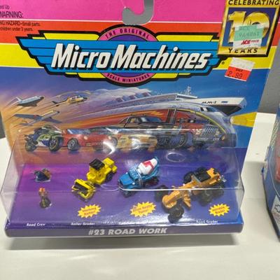 Micro machines a Camaro that makes sounds a Duncan yo-yo and a Shrek McDonald’s happy meal toy