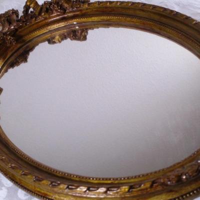 Vintage framed mirror with cameo in the frame