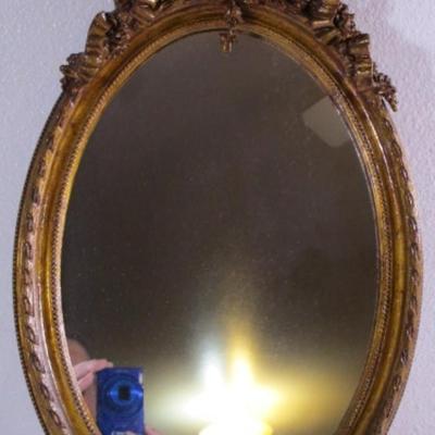 Vintage framed mirror with cameo in the frame