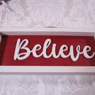 1 book "Believe", wall hanging also "Believe"