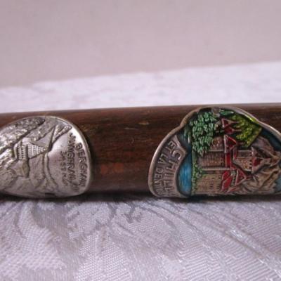 Wood cane with Swiss & German metal medallions