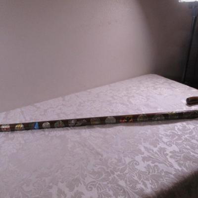 Wood cane with Swiss & German metal medallions