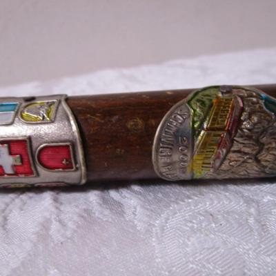 Wood cane with Swiss & German metal medallions