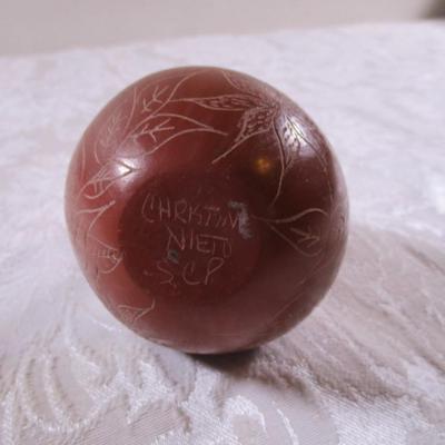 Clay stone-polished vase with flower etching on it