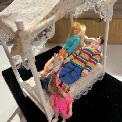 Doll Family and Canopy Bed