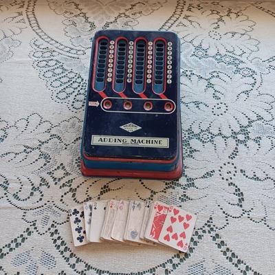 WOLVERINE TIN TOY ADDING MACHINE & A SMALL DECK OF CARDS