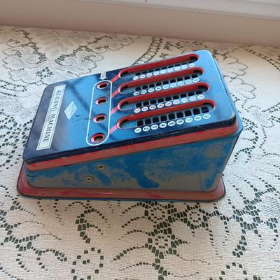 WOLVERINE TIN TOY ADDING MACHINE & A SMALL DECK OF CARDS