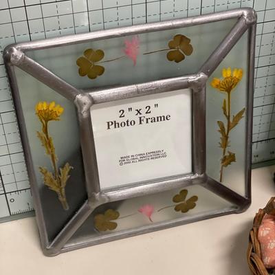 Frames and small baskets with egg ornament