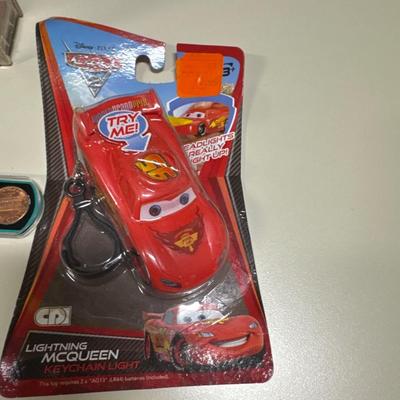 Coin separator, Hot Wheels, key chains, toy motorcycle and toy skateboards