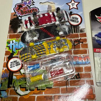 Coin separator, Hot Wheels, key chains, toy motorcycle and toy skateboards