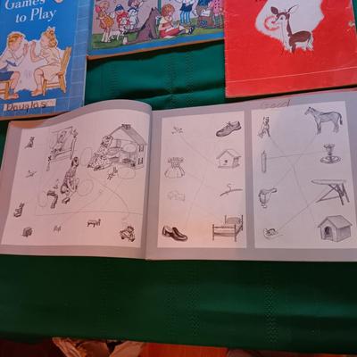CHILDREN'S WORKBOOKS, SHEETS OF WRITING PAPER AND A BOOK