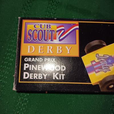 ROCKY MOUNTAIN NEWS WOODEN COIN BANK, PLASTIC BOAT AND NIB CUB SCOUT PINEWOOD DERBY KIT