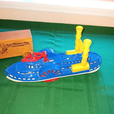 ROCKY MOUNTAIN NEWS WOODEN COIN BANK, PLASTIC BOAT AND NIB CUB SCOUT PINEWOOD DERBY KIT