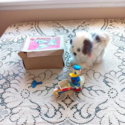 VINTAGE WIND UP JUMPING DOG AND DONALD DUCK TOY