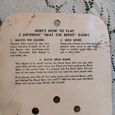 1961 "BEAT THE BEENS", MR POTATO HEAD TYPE TOY AND 2 FACES ON SPRINGS??
