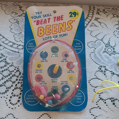 1961 "BEAT THE BEENS", MR POTATO HEAD TYPE TOY AND 2 FACES ON SPRINGS??