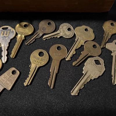 Wood box full of keys and locks