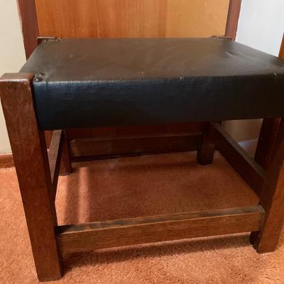 Black padded ottoman