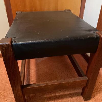 Black padded ottoman