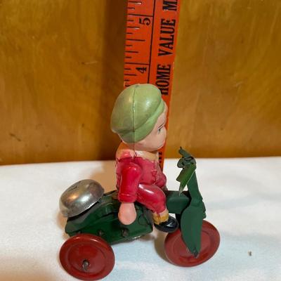 Vintage boy on tricycle wind up toy