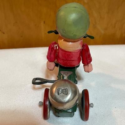 Vintage boy on tricycle wind up toy