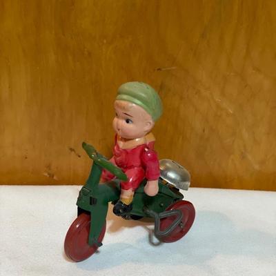 Vintage boy on tricycle wind up toy