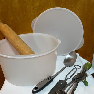 Vintage kitchen utensils and large Tupperware container
