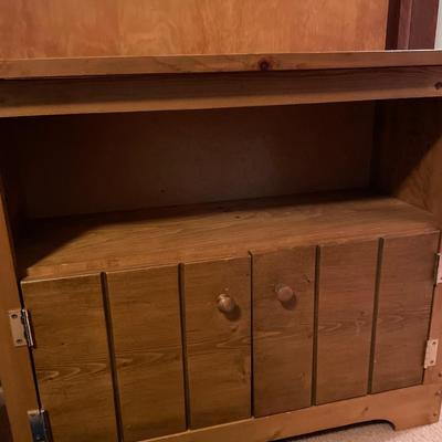 Small wood shelving with storage underneath
