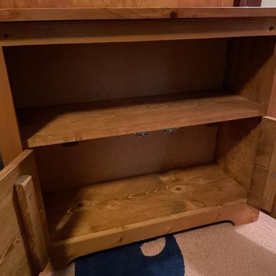 Small wood shelving with storage underneath