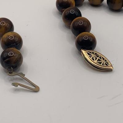 LOT 3: Collection of Tiger-eye Beaded Jewelry: 24" Strand of Tiger-eye Beads, Matching Stretch Bracelet, Pierced Earrings w 14k Gold...