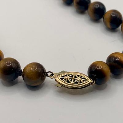 LOT 3: Collection of Tiger-eye Beaded Jewelry: 24" Strand of Tiger-eye Beads, Matching Stretch Bracelet, Pierced Earrings w 14k Gold...