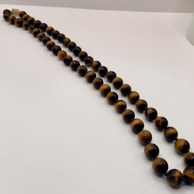 LOT 3: Collection of Tiger-eye Beaded Jewelry: 24" Strand of Tiger-eye Beads, Matching Stretch Bracelet, Pierced Earrings w 14k Gold...