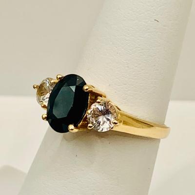LOT4: Beautiful 14k Gold Ring with Oval Cut Blue Sapphire Flanked by 2 Round White Sapphires - 2.8 gtw sz5