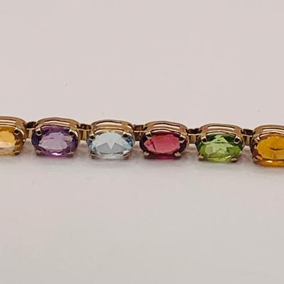 LOT 8: Semi-Precious Oval Faceted Gemstone and 14K Gold Bracelet - Blue Topaz, Amethyst, Garnet, Citrine, Peridot 7" Long 6.2 gtw