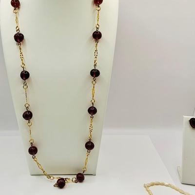 LOT 22: Collection of Deep Purple Beaded Necklaces, Purple Earrings, Pansy Pendant Necklace and More