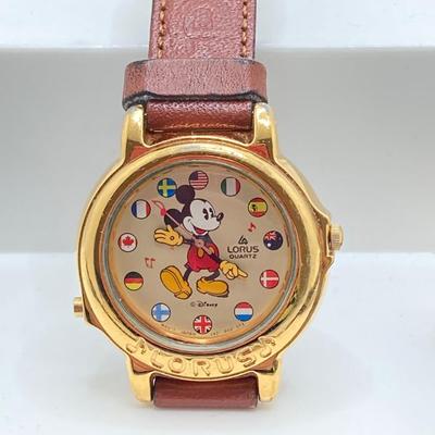 LOT 55J: Three Disney Mickey Mouse (Lorus / Ingersoll) Watches and One Stars and Stripes Mickey Mouse Pin