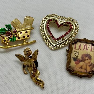 LOT 90: Collection of Holiday Brooches including a Tona Gold Tone Enamel Cornucopia Pumpkin Brooch, Eisenberg Christmas Tree Brooch...