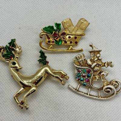 LOT 90: Collection of Holiday Brooches including a Tona Gold Tone Enamel Cornucopia Pumpkin Brooch, Eisenberg Christmas Tree Brooch...